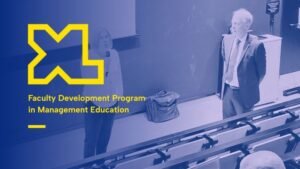Blue-tinted banner of a lecture hall with two speakers and a large yellow logo, text reads 'Faculty Development Program in Management Education'.
